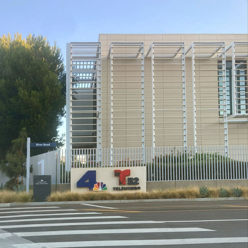 Professional odor removal technicians setting up specialized equipment to eliminate foul plumbing and sink smells in a Universal City commercial studio.